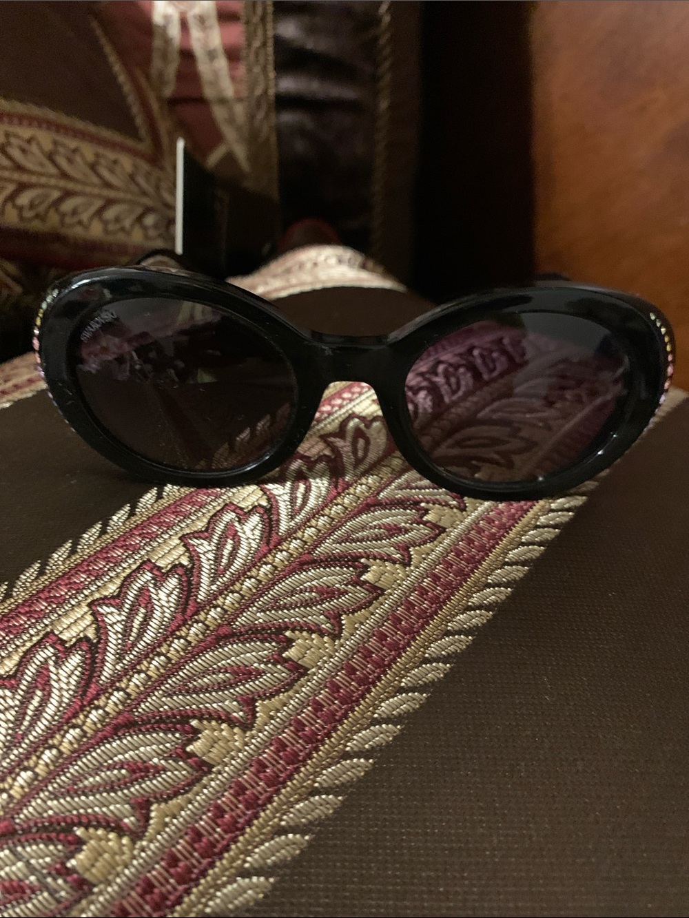Swarovski Black Oval Sunglasses with Dark Gray Lenses